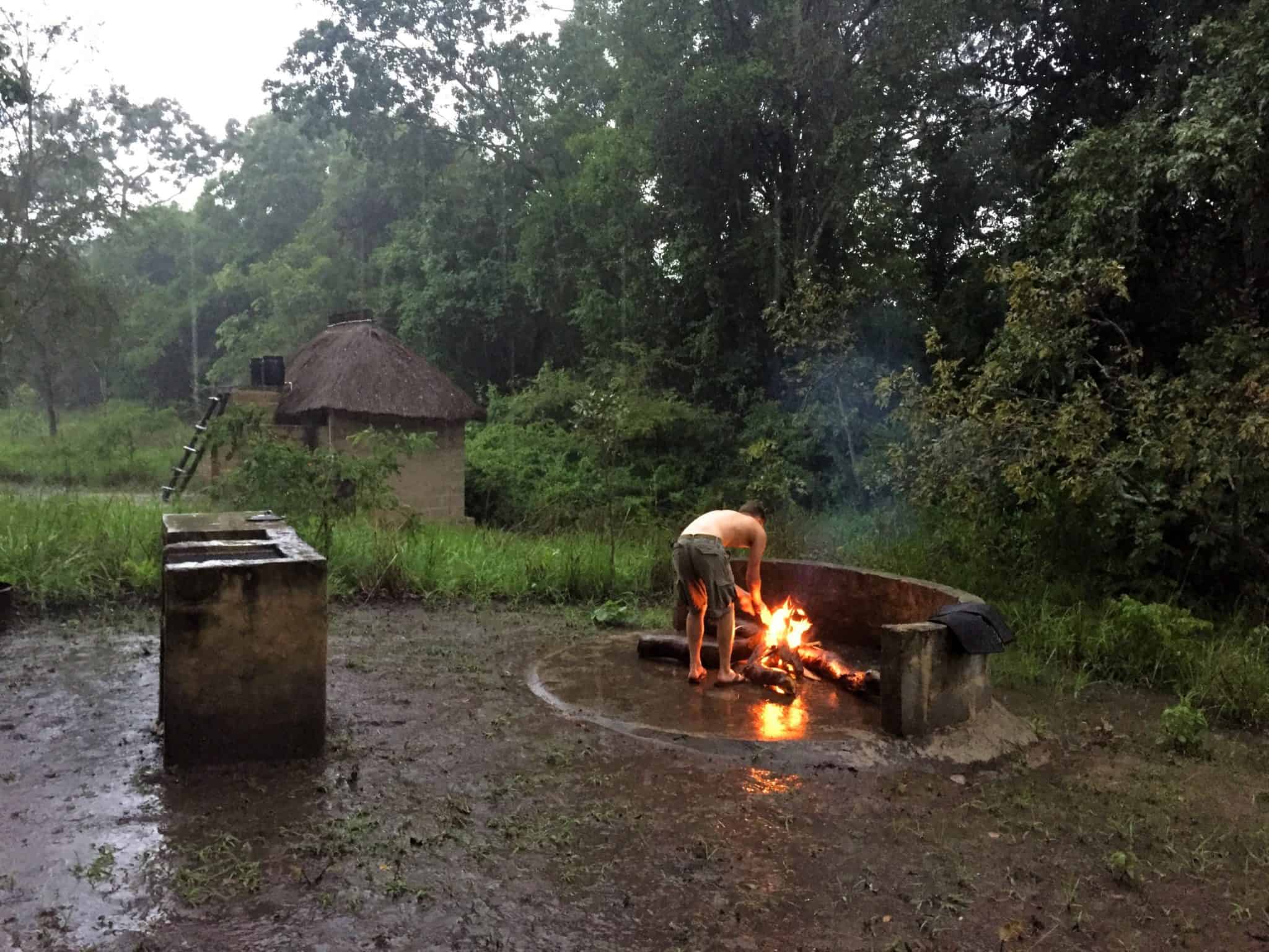 Stoking the fire in the rainy season of Zambia in Kasanga National Park