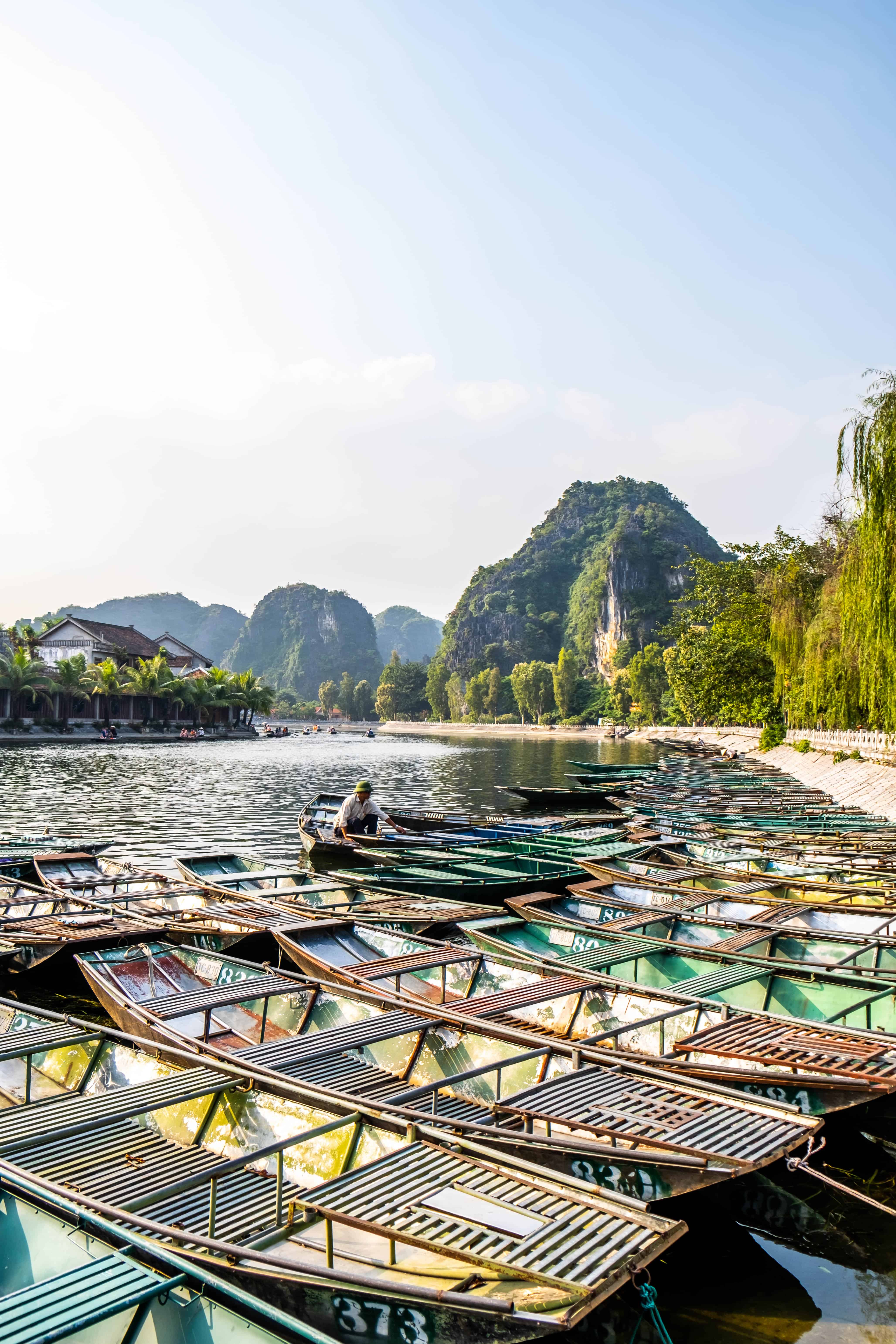 Boats Along River In Ninh Binh, Vietnam 