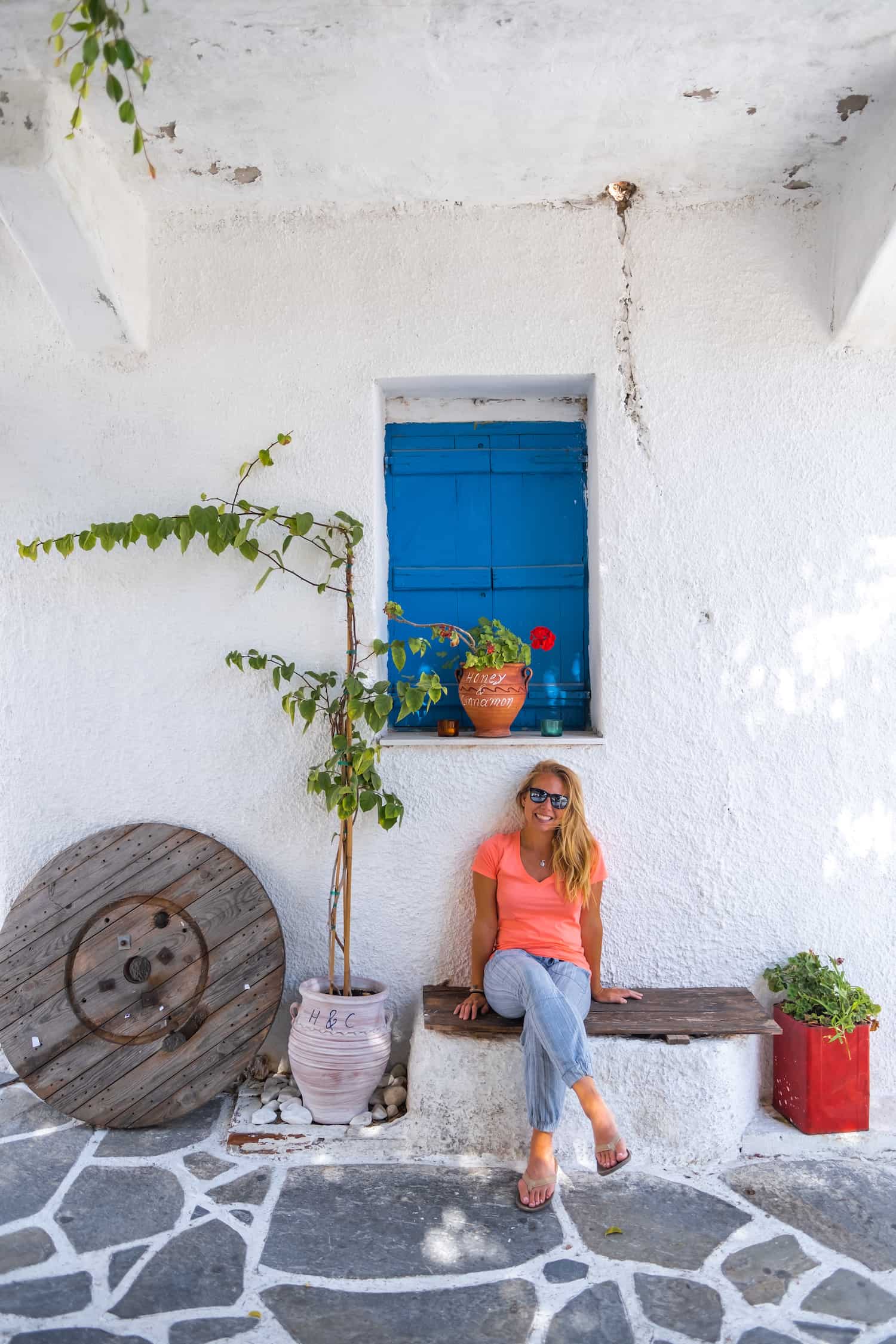 Sitting In Naxos Chora With A Pink V-Neck