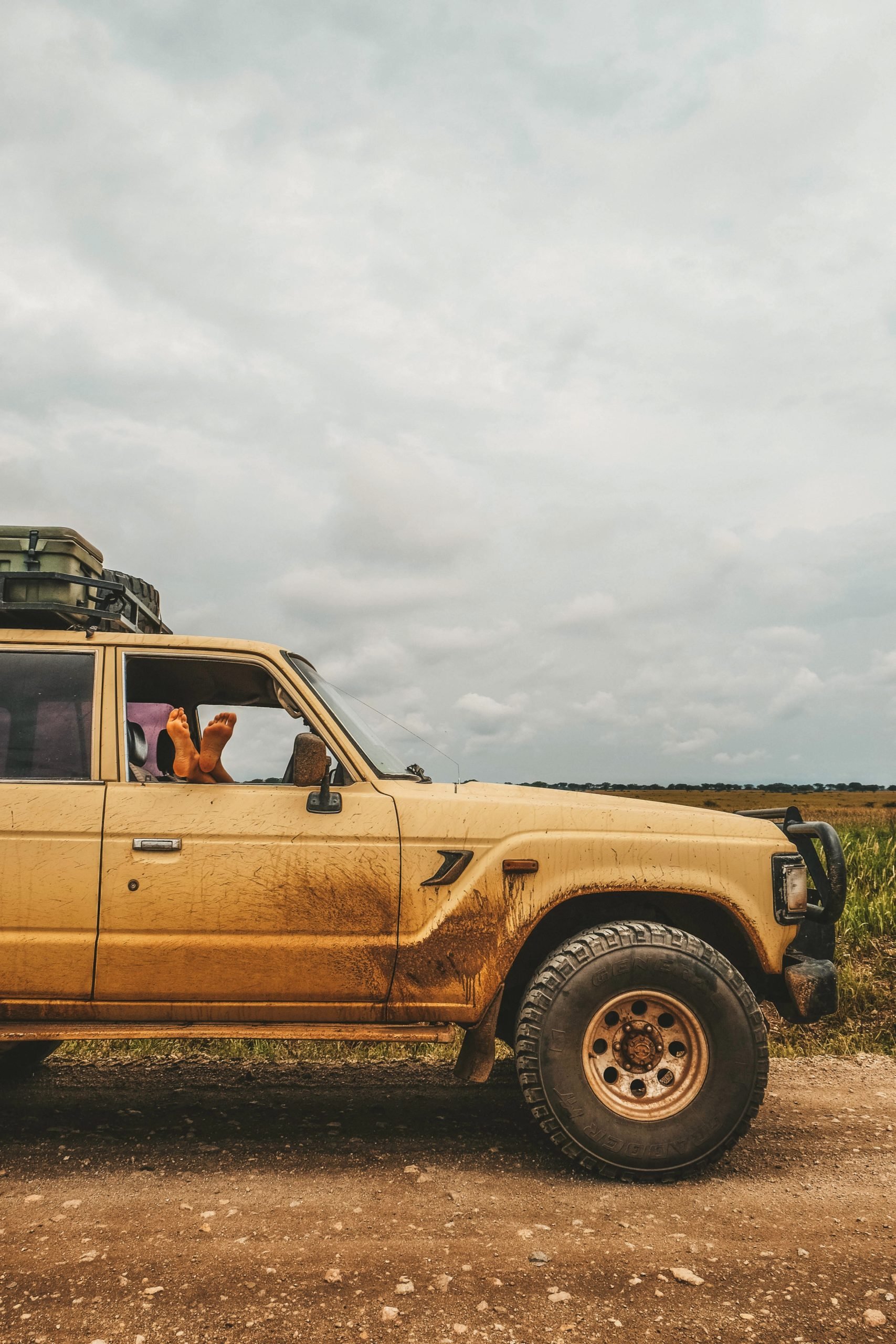 Tasha Relaxing in the Land Cruiser in Uganada