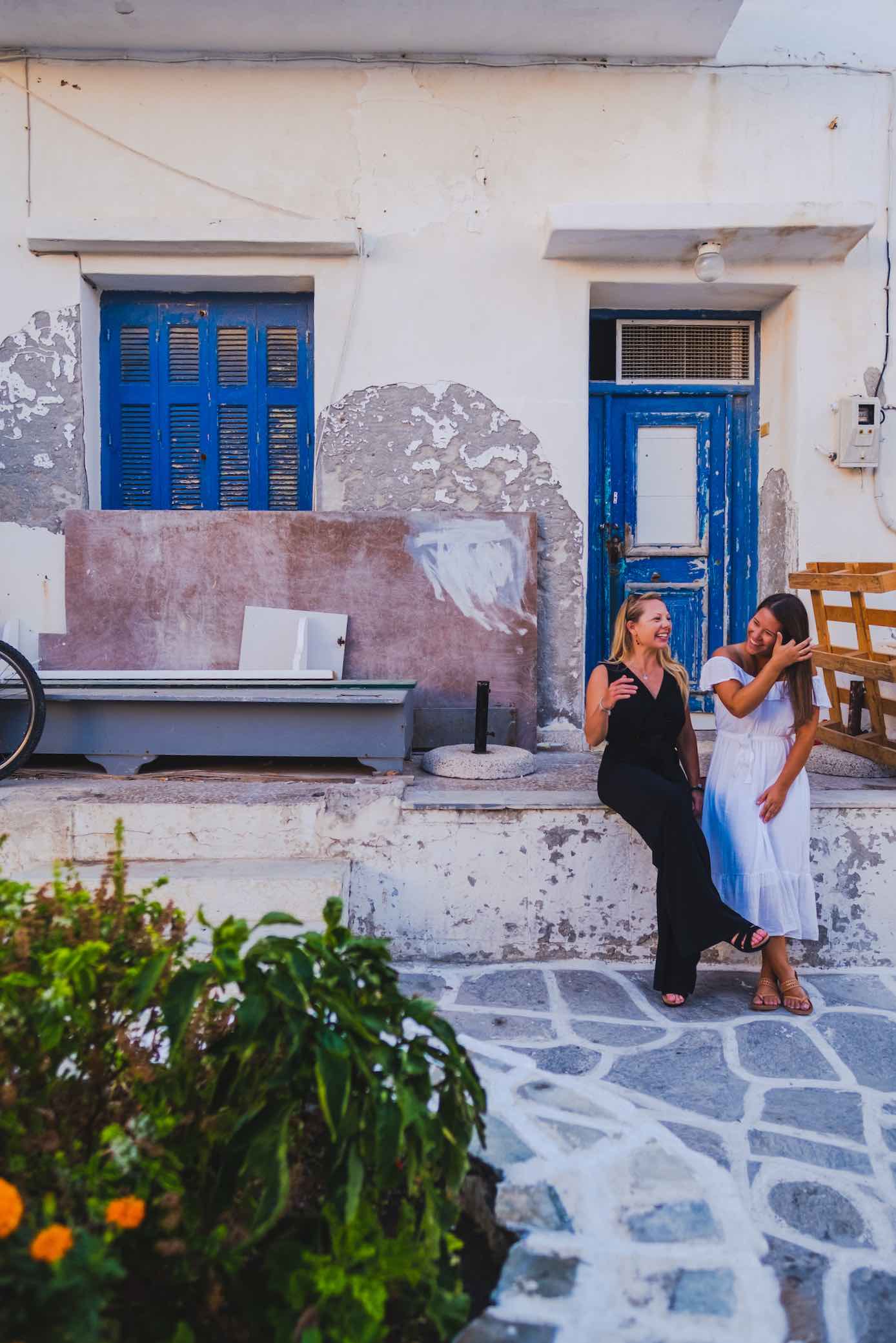 Natasha and Kelsey Sitting On A Porch In Greece