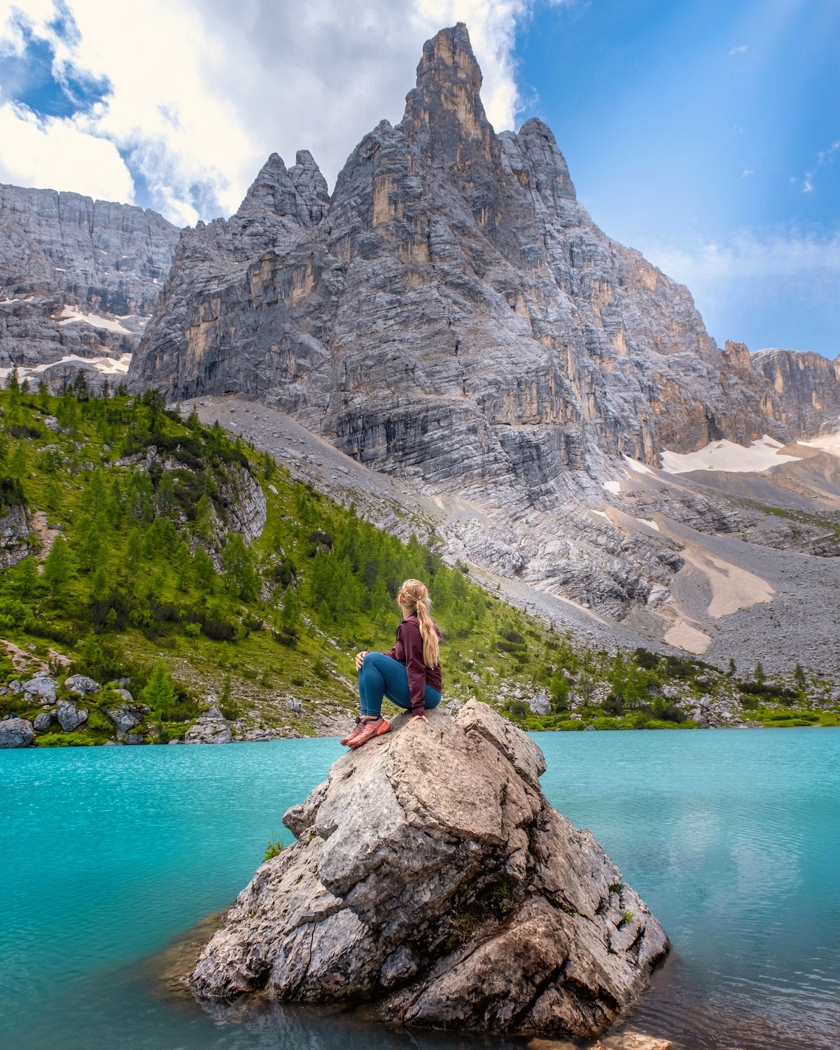 Natasha Sitting At Lake Sorapis In The Dolomites After Hiking